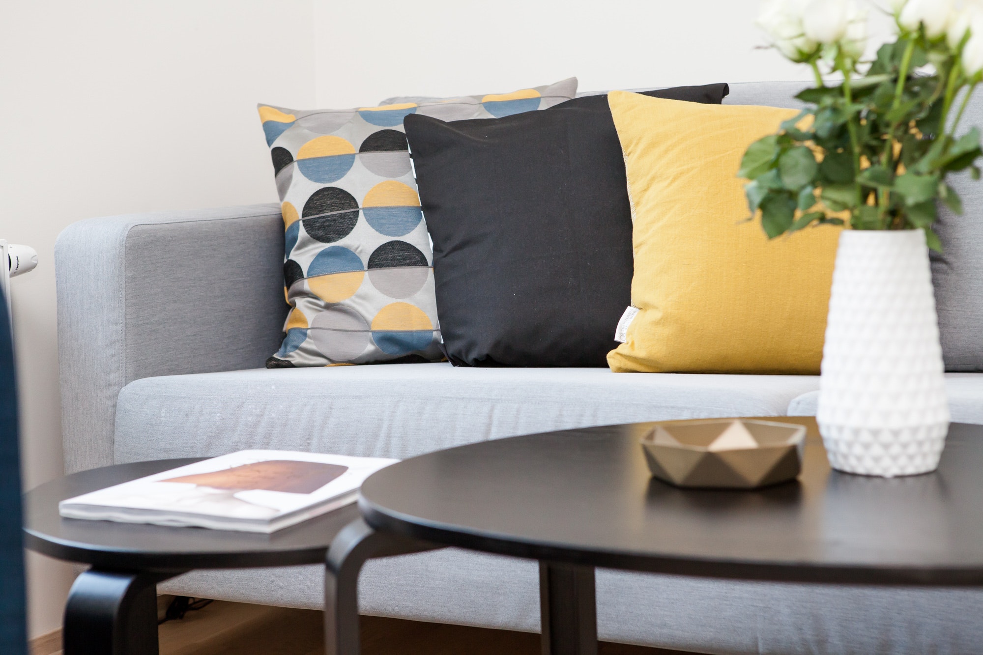 grey sofa and nesting tables