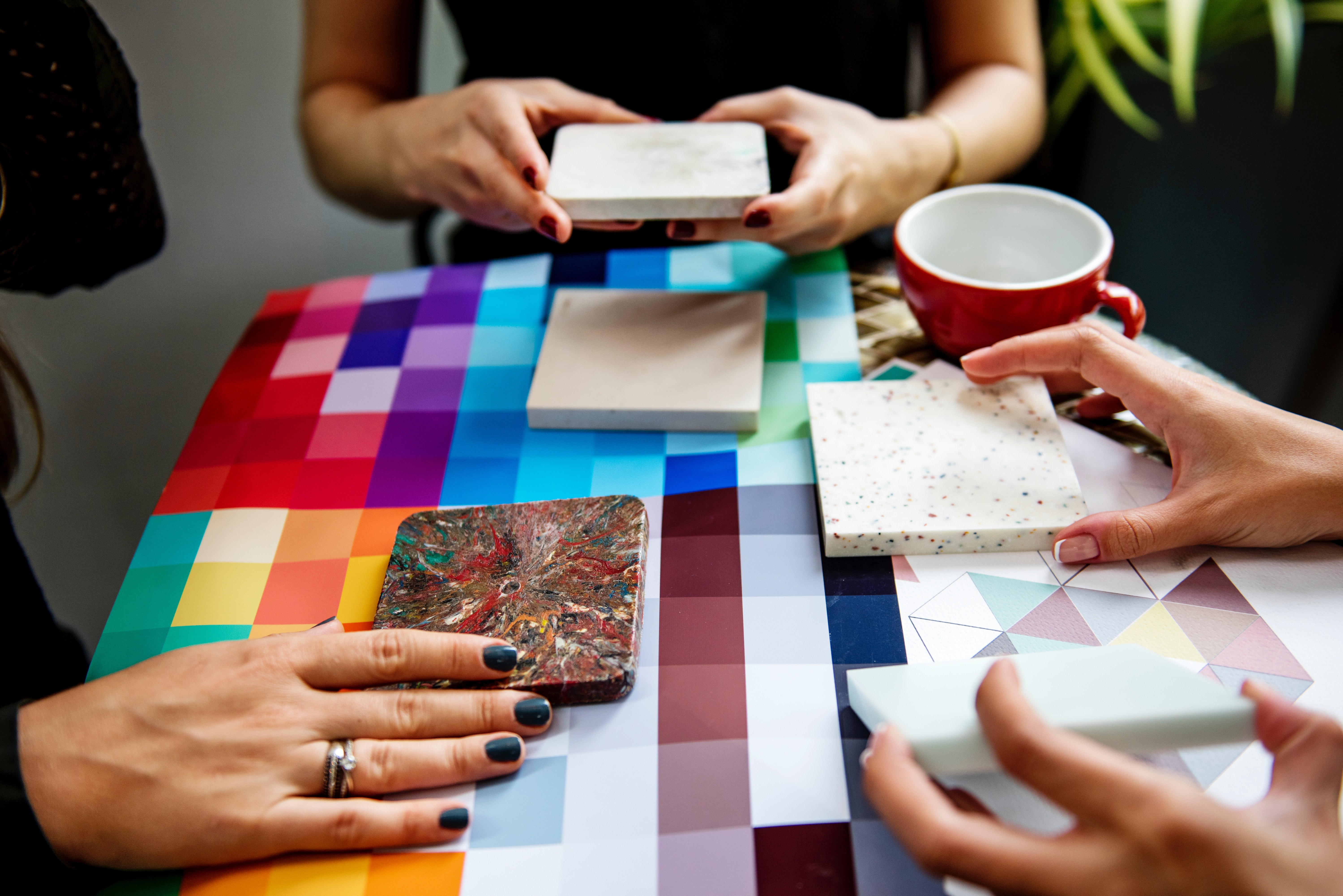 team comparing design patterns on tile squares